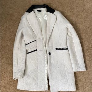 White and black leather coat